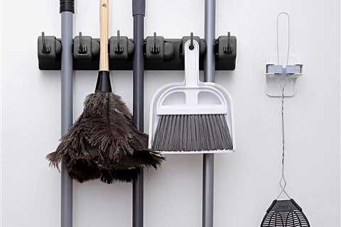 This Mop and Broom Holder Instantly Declutters Your Cleaning Closet or Garage